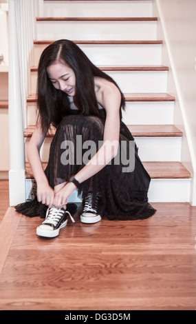 Teen Girl in Black Dress Getting Ready for Party Stock Photo