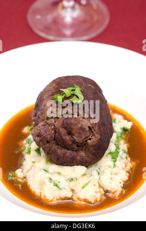 Beef roulade with mashed celeriac and gravy Stock Photo
