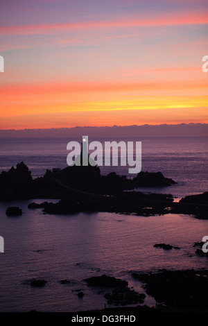 Corbiere Point and Lighthouse. St. Brelade. SW. Jersey, Channel Islands. UK. August evening sunset. Stock Photo