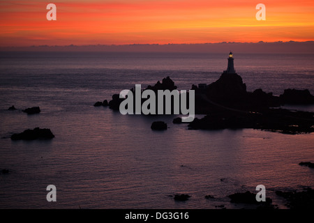 Corbiere Point and Lighthouse. St. Brelade. SW. Jersey, Channel Islands. UK. August evening sunset. Stock Photo