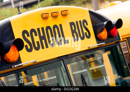 School bus sitting in the parking lot waiting to be in service Stock Photo