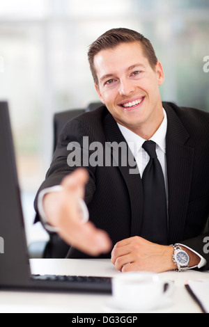 happy businessman offering handshake in office Stock Photo