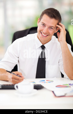 happy business executive sitting in office Stock Photo