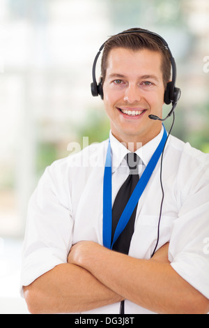 portrait of happy call center customer service worker with arms crossed Stock Photo