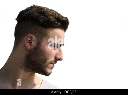 Portrait, profile shot of young man's face looking to a side, isolated on white Stock Photo