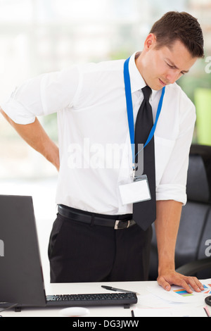 businessman having lower back pain in office Stock Photo