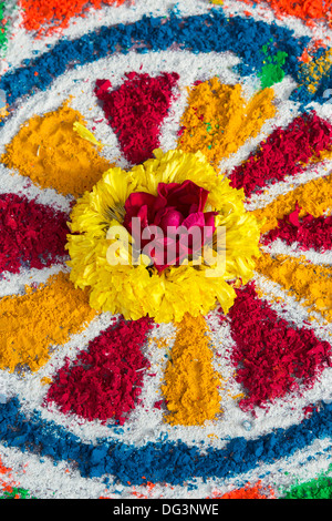 Derasar Rangoli Dasara Rangoli festival coloured powder design and flowers in an Indian ...