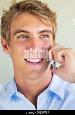 Young Handsome Attractive Business Man Smiling Talking on Smart Phone Stock Photo