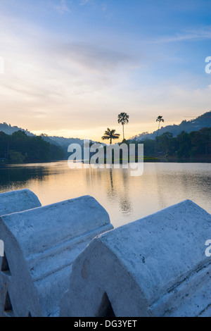 Kandy Lake at sunrise, the island of the Royal Summer House, with the Clouds Wall in the foreground, Kandy, Sri Lanka, Asia Stock Photo