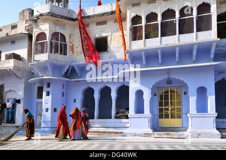 Ghats at Holy Pushkar Lake and old Rajput Palaces, Pushkar, Rajasthan, India, Asia Stock Photo