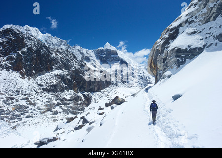 Trekker walking over Cho La Pass with Lobuche West and East on left side, Solukhumbu District, Nepal, Himalayas, Asia Stock Photo