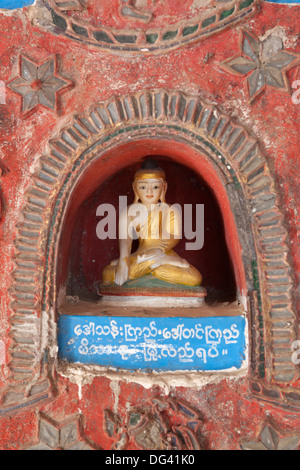 Buddha offerings in wall niche, Shwe Yan Pyay monastery, Nyaungshwe, Inle Lake, Shan State, Myanmar (Burma), Asia Stock Photo