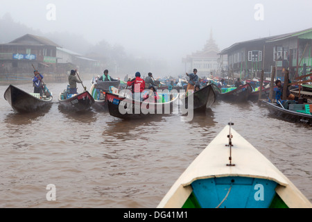 Tourist boats in early morning fog at jetty, Nyaungshwe, Inle Lake, Shan State, Myanmar (Burma), Asia Stock Photo
