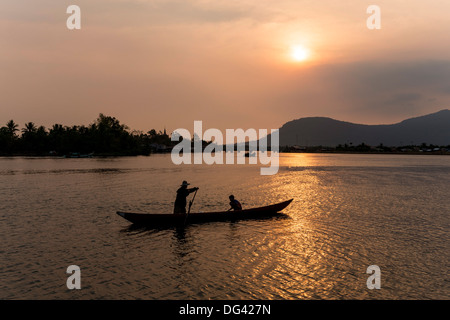 Father and son fishing on Kampong Bay River at sunset, Kampot, Cambodia, Indochina, Southeast Asia, Asia Stock Photo
