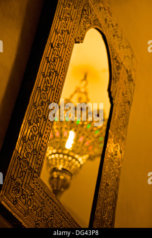 Brass ceiling lamp, reflected in typical mirror, Marrakech, Morocco, North Africa, Africa Stock Photo