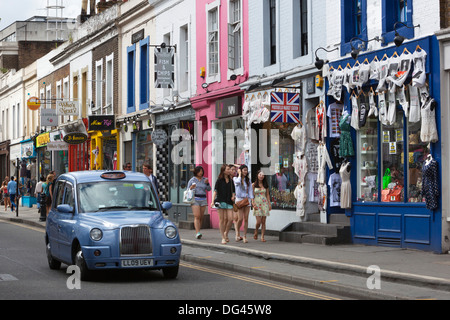 Trendy shops and taxi, Pembridge Road, Notting Hill, London, England, United Kingdom, Europe Stock Photo