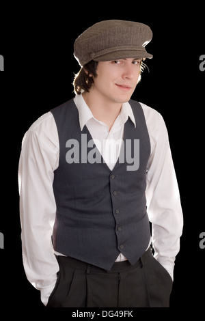 Young man standing with hands deep in his pockets Stock Photo