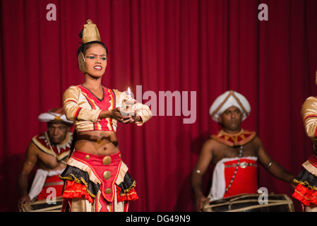 Woman dancing traditional Kandyan dance at a tourist show in Kandy, Sri Lanka, Asia Stock Photo