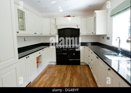 Modern white and Black Kitchen in large house Stock Photo