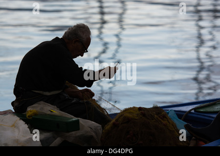 Old hands, Dexterity, mending nets, fishing net, repairing nets Stock Photo