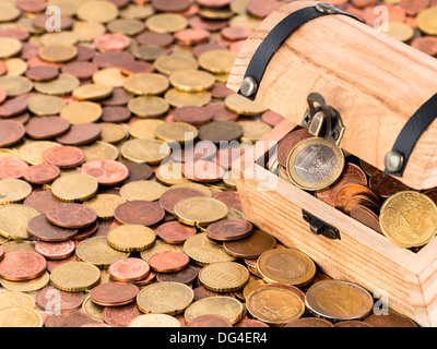 A treasure chest with a bunch of Euro coins and cents Stock Photo