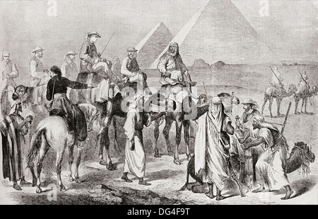 Victorian tourists at the pyramids of Giza, Egypt in the nineteenth century. Stock Photo