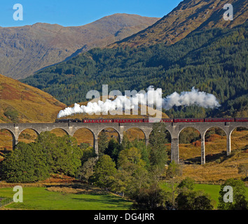 Jacobite Steam Train crossing Glenfinnan Viaduct Lochaber Scotland UK Stock Photo
