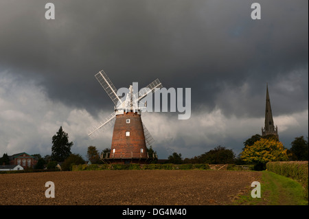 Thaxted, Essex, England. July 2013 Seen here:  John Webb's Windmill and Thaxted Church with a autumnal stormy sky. Stock Photo