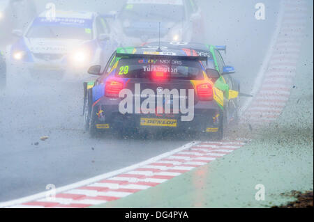 Brands Hatch, Kent, UK. 13th Oct, 2013. eBay Motors team mates Colin Turkington and Nick Foster collide head on after Colin loses the back end of his BMW 125i M Sport during the start of race 1 of final day of the Dunlop British Touring Car Championships from the Brands Hatch track. Credit:  Action Plus Sports/Alamy Live News Stock Photo