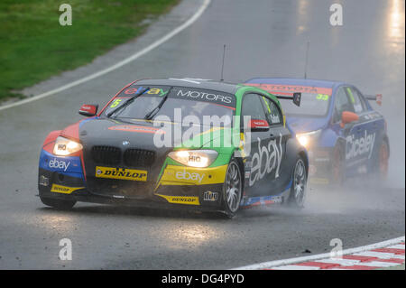 Brands Hatch, Kent, UK. 13th Oct, 2013. Robert Collard driving the eBay Motors BMW 125i M Sport followed by Adam Morgan driving the Ciceley Racing Toyota Avensis during race 1 of the final day of the Dunlop British Touring Car Championships from the Brands Hatch track. Credit:  Action Plus Sports/Alamy Live News Stock Photo