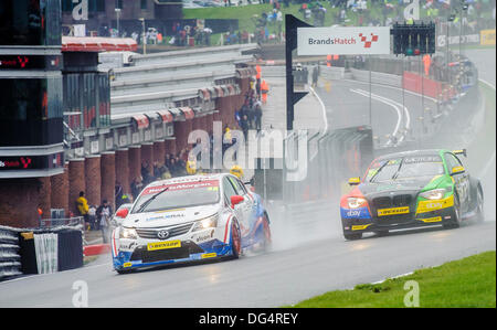 Brands Hatch, Kent, UK. 13th Oct, 2013. Colin Turkington driving the eBay Motors BMW 125i M Sport and Ollie Jackson driving the Speedworks Motorsport Toyota Avensis during the final day of the Dunlop British Touring Car Championships from the Brands Hatch track. Credit:  Action Plus Sports/Alamy Live News Stock Photo