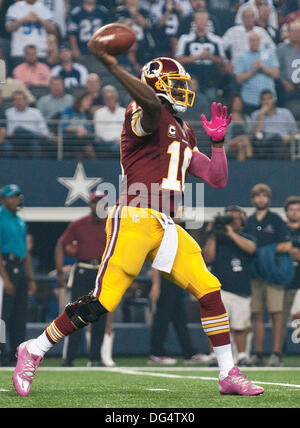 Arlington, Texas, USA. 13th Oct, 2013. October 14, 2013 Arlington, Tx. USA. Washington Redskins quarterback Robert Griffin III throws as the Dallas Cowboys defeated Washington Redskins 31 to 16 at ATT Stadium in Arlington, Tx. Credit:  Ralph Lauer/ZUMAPRESS.com/Alamy Live News Stock Photo