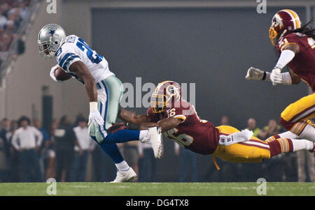 Arlington, Texas, USA. 13th Oct, 2013. October 14, 2013 Arlington, Tx. USA. Dallas Cowboys Runningback DeMarco Murray breaks a tackle by Washington Redskins Perry Riley Jr. in the first quarter as the Dallas Cowboys defeated Washington Redskins 31 to 16 at ATT Stadium in Arlington, Tx. Credit:  Ralph Lauer/ZUMAPRESS.com/Alamy Live News Stock Photo