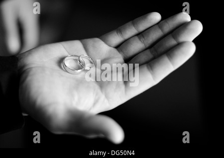 Wedding Rings, held by the Groom Stock Photo