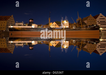 Mirror view of the Soldek at night in the river Motlawa, famous ship in the old port of Gdansk. Stock Photo