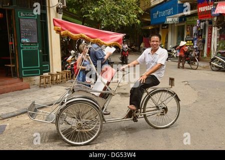 Cyclo driver in Hanoi, Vietnam Stock Photo