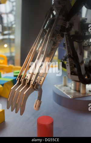 Future technology in black prosthetic hand with a blurred background Stock Photo