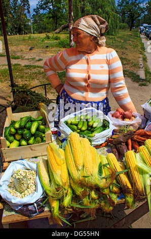 Ukrainian 'babushka' selling her home produce at the local market in Kiev, Ukraine Stock Photo
