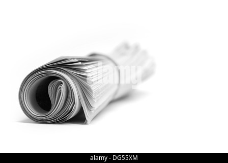 Rolled up newspaper isolated on white background Stock Photo