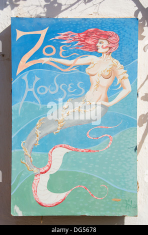 SANTORINI (THIRA), CYCLADES, GREECE. A colourful sign outside a guest house in the village of Oia. 2013. Stock Photo