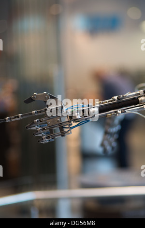 Future technology in black prosthetic hand with a blurred background Stock Photo