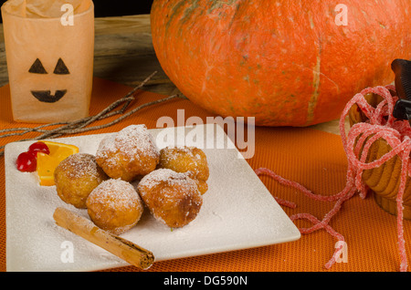 A traditional Spanish Halloween dessert served with holiday decoration. Stock Photo