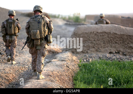US Marines with Alpha company, 9th Marine Regiment during a foot patrol October 12, 2013 in Helmand province, Afghanistan. Stock Photo