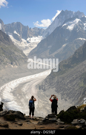 A trekker looking down on the Mer de Glace from Signal Forbes, Chamonix, France Stock Photo