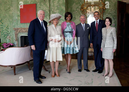 US President Barack Obama and First Lady Michelle Obama greet the Prince of Wales and the Duchess of Cornwall at Winfield House May 24, 2011 in London, England. Stock Photo