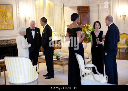 US President Barack Obama and First Lady Michelle Obama talk with Queen Elizabeth II, Prince Philip, Duke of Edinburgh, Ambassador Louis Susman and Mrs. Susman before dinner at Winfield House May 25, 2011 in London, England, Stock Photo