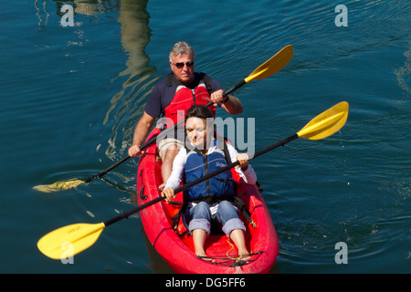 Couple kayaking in Santa Barbara harbor Stock Photo