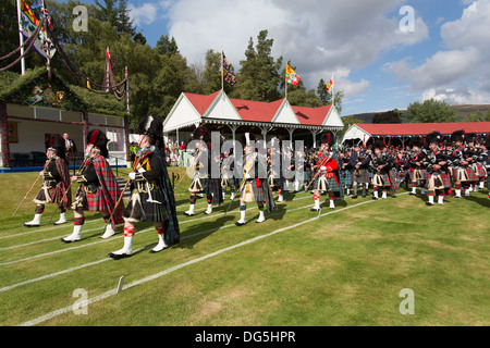 Village of Braemar, Scotland. The massed pipe bands marching at the Royal Braemar Gathering games. Stock Photo