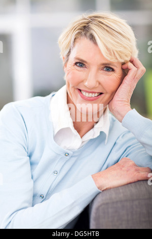 Portrait of elegant mature woman sitting on patio chair Stock Photo - Alamy