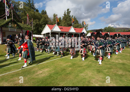 Village of Braemar, Scotland. The massed pipe bands marching at the Royal Braemar Gathering games. Stock Photo